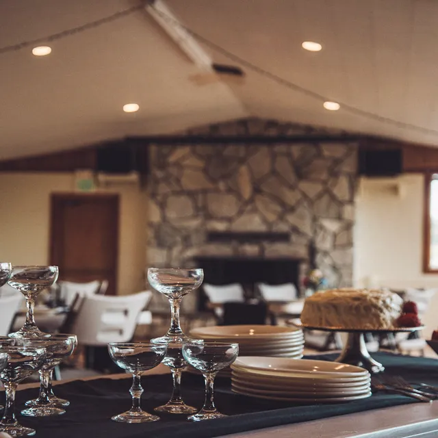 Stone fireplace with buffet table set for an event